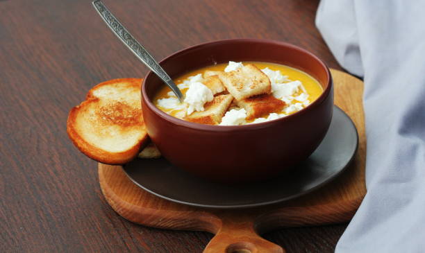 Pumpkin soup with homemade  breadsticks and feta cheese